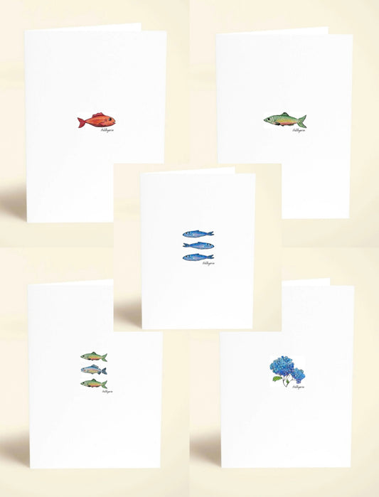Set of greeting cards with fish illustrations on a beige background