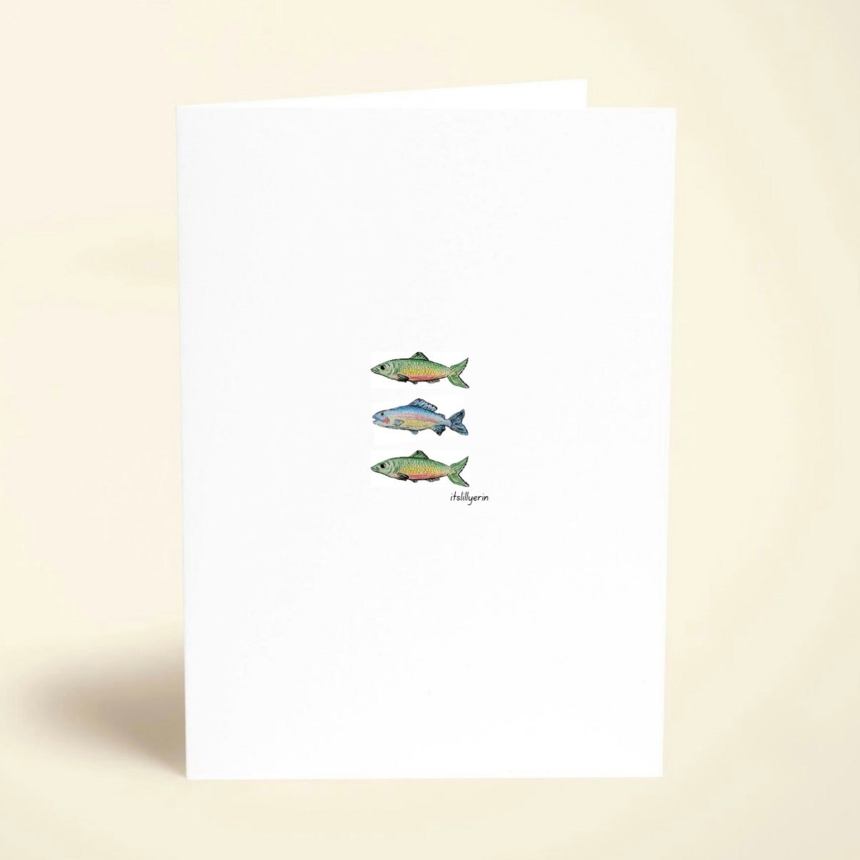 Three fish illustrations on a white card with a beige background
