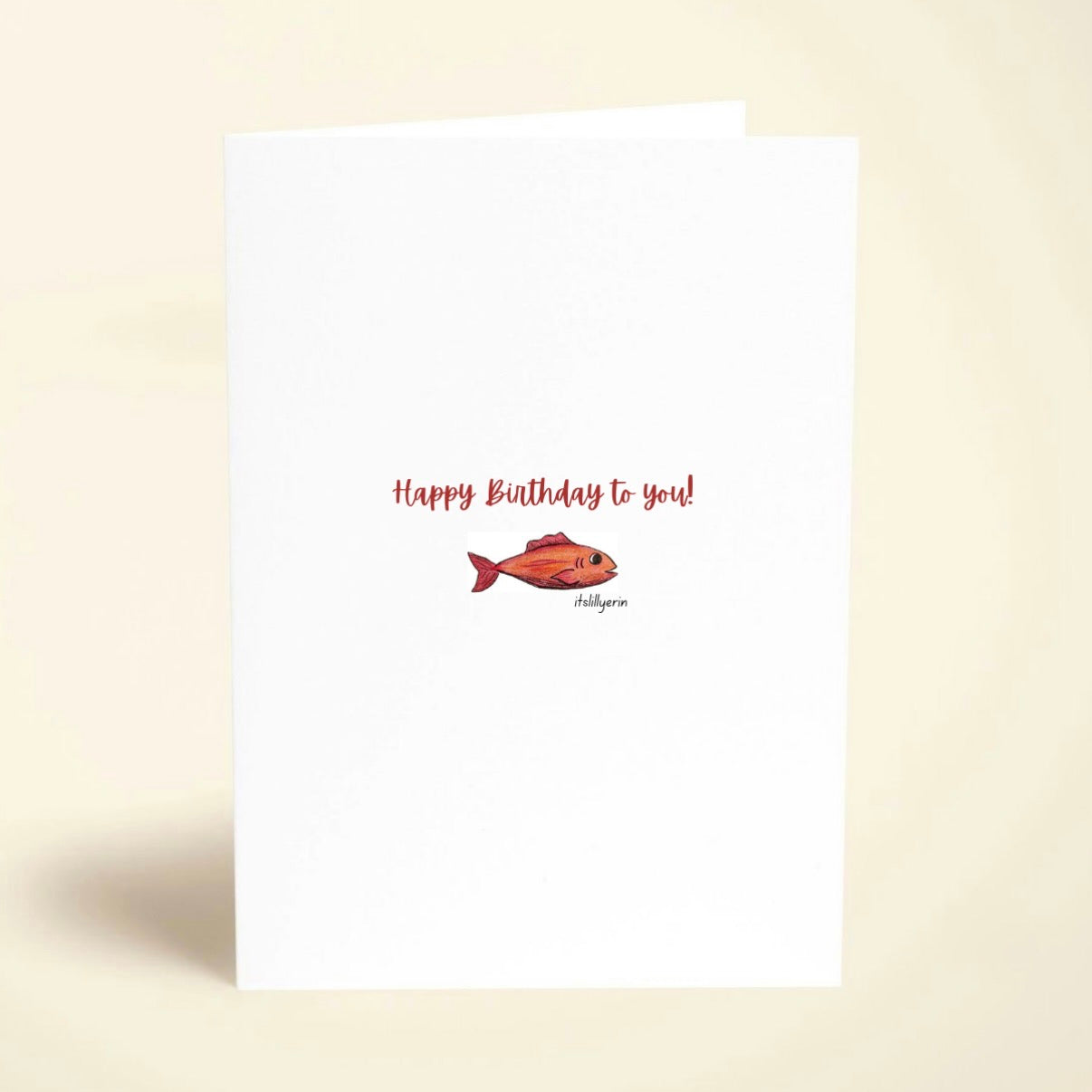 Birthday card with a fish illustration and 'Happy Birthday to you!' text on a beige background