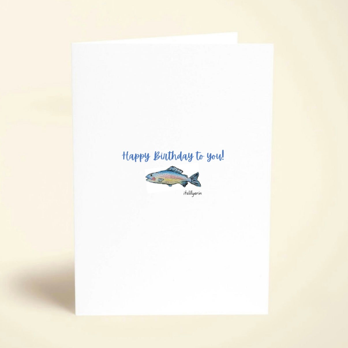 Birthday card with fish illustration and text on a beige background