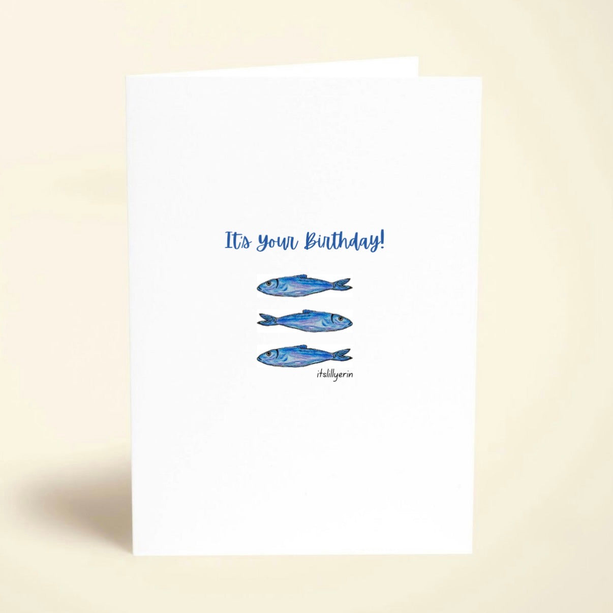 Greeting card with blue fish illustrations and 'It's your Birthday!' text on a white background