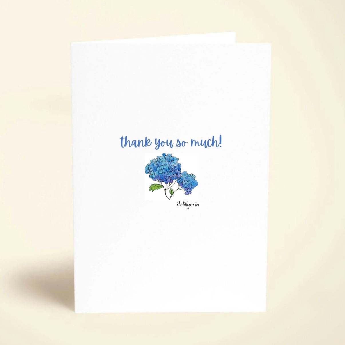 Greeting card with blue hydrangea illustration and 'thank you so much!' text on a beige background