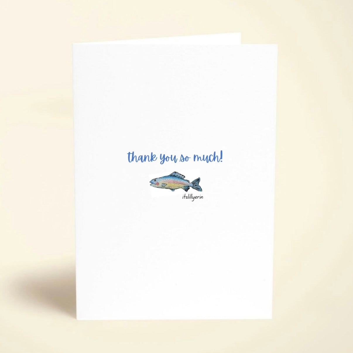 Note card with fish illustration and 'thank you so much!' text on a beige background