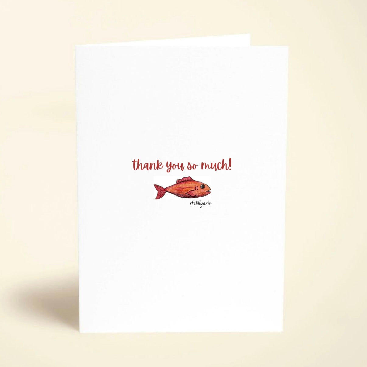 Note card with a fish illustration and 'thank you so much!' text on a beige background
